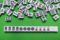 Full of Mahjong tiles on green background