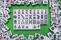 Full of Mahjong tiles on green background