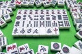 Full of Mahjong tiles on green background