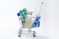 full of medicines little shopping cart on a white background