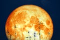 full milk blood moon back on silhouette antennas on night sky