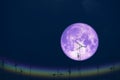 full milk moon back on silhouette antennas on the night sky