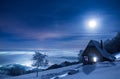 Full moon above a fairytale landscape in the mountains of Romania Royalty Free Stock Photo