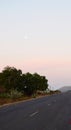 Full Moon above Indian Road with Rural Landscape in Early Morning