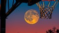 Full moon aligned with basketball hoop at dusk