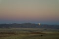 Full moon ascends over the dune in Namib desert Namibia Royalty Free Stock Photo