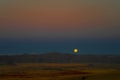 Full moon ascends over the dune in Namib desert