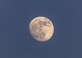 Full moon close up on blue sky background Royalty Free Stock Photo
