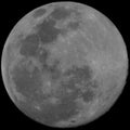 Full moon closeup black background Royalty Free Stock Photo