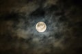 Full moon in the dark night sky with clouds. Halloween background,dark clouds, closeup Royalty Free Stock Photo