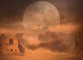 Full moon on desert mountain peaks at sand storm Royalty Free Stock Photo