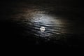 Full moon with dramatic clouds and lunar halo background Royalty Free Stock Photo