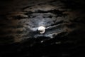 Full moon with dramatic clouds and lunar halo Royalty Free Stock Photo