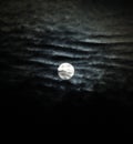 Full moon with dramatic clouds and lunar halo vertical Royalty Free Stock Photo