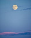 Full moon in early evening sky