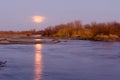 Full Moon on the Horizon Reflecting in the Platte River Water Royalty Free Stock Photo
