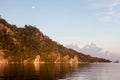 Full Moon and Morning Light on Limestone Island in Raja Ampat Royalty Free Stock Photo