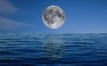 Full moon at night over the sea Royalty Free Stock Photo