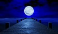 The full moon at night was full of stars and a faint mist. A wooden bridge extended into the sea. Fantasy image at night, super Royalty Free Stock Photo