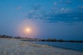 Full moon over the beach of the ocean, the sea on a summer Royalty Free Stock Photo