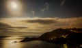 Full moon over coastal view