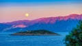 Full moon over Crete at sunset Royalty Free Stock Photo