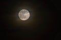 Full moon over dark black sky at night Royalty Free Stock Photo