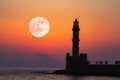 Full moon over Lighthouse of Chania at summer sunse Royalty Free Stock Photo