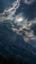 Full moon over mountain peaks with dramatic clouds Royalty Free Stock Photo