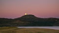 Full moon over mountains - Isle of Skye - purple morning sky and huge moon Royalty Free Stock Photo