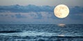 Full moon over the ocean at night Royalty Free Stock Photo