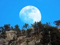 A full moon over the rocky alpine peak of Musflue in the Swiss mountain range of Pilatus and in the Emmental Alps, Alpnach Royalty Free Stock Photo