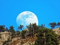 A full moon over the rocky alpine peak of Musflue in the Swiss mountain range of Pilatus and in the Emmental Alps, Alpnach Royalty Free Stock Photo