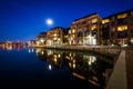 The full moon over a waterfront apartment building in Fells Point, Baltimore, Maryland. Royalty Free Stock Photo