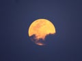 Full Moon Partially Hidden With Clouds.