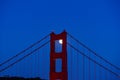 Full moon peaking through the north tower of the Golden Gate Bridge in San Francisco in June of 2022 Royalty Free Stock Photo