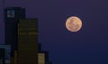 Super moon rise near Modern CBD buildings