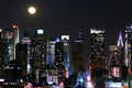 A Full Moon Rises Over Manhattan Royalty Free Stock Photo