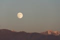Full moon rises over mountain range evening sky Royalty Free Stock Photo