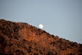 A full moon rises over the mountains. Evening sky Royalty Free Stock Photo