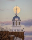 Full moon rising behind a beautiful building with a white steeple. Garden City, New York Royalty Free Stock Photo