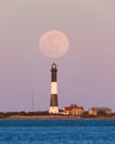 Full moon rising behind the Fire Island Lighthouse