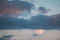 Full Moon Rising In Cloudy Evening Sky Royalty Free Stock Photo