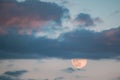 Full Moon Rising In Cloudy Evening Sky. Full Moon Rising In Cloudy Evening Sky Royalty Free Stock Photo