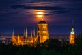 A full moon rising over the city of Gdansk at dusk, Poland