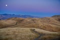 Full moon rising over golden hills, as seen from Mission Peak, San Francisco bay area, California Royalty Free Stock Photo