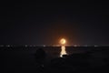 Full moon rising over sea at night with copy space. big full moon reflecting in a sea. Azerbaijan Royalty Free Stock Photo