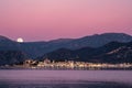 Full moon rising over St Florent in Corsica Royalty Free Stock Photo