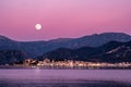 Full moon rising over St Florent in Corsica Royalty Free Stock Photo