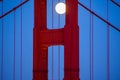 The full moon is seen through the window of the north tower of the Golden Gate Bridge in June of 2022. Royalty Free Stock Photo